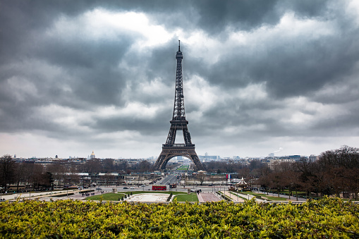 The famous Tour Eiffel at the end of winter under storm clouds