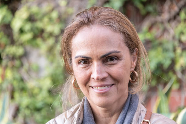 istock Smiling hispanic woman looking at the camera 1006817396
