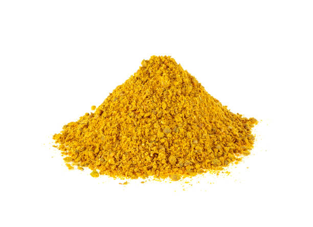 istock Heap of curry isolated on white background 1006821266