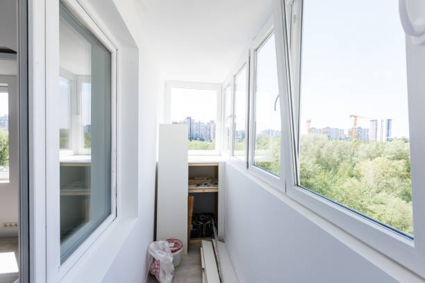 istock White metal-plastic windows of balcony in modern apartment 1006835334