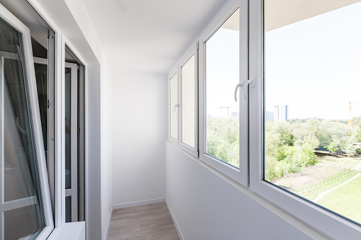 Modern metal-plastic window and door in new apartment