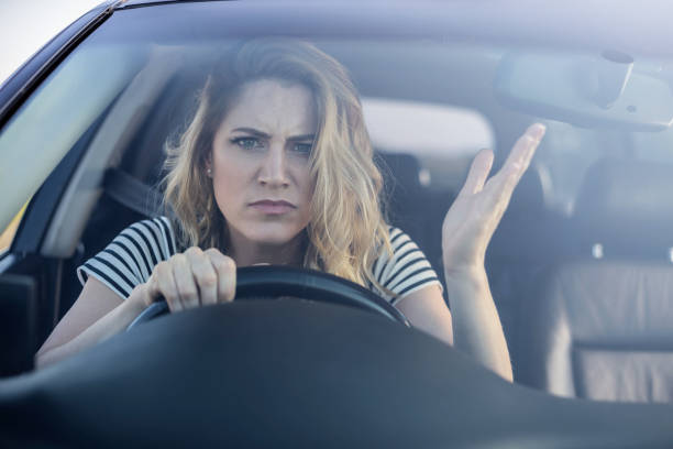 istock Angry woman driving a car 1006838004