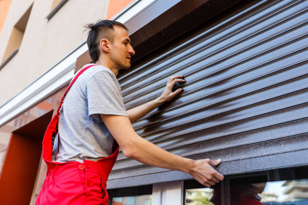 Man installing roller shutter on window Man installing roller shutter on window retractable photos stock pictures, royalty-free photos & images