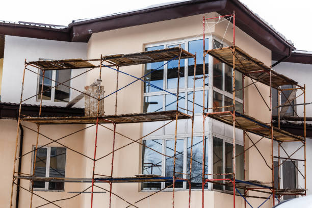 istock Scaffolding covering a facade of an old building under renovation 1006847100