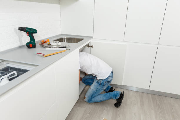 istock Man repairing a kitchen sink at home 1006851674