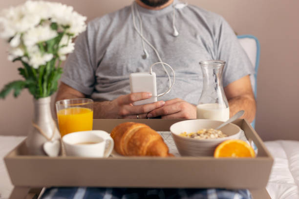 istock Man listening to music in bed 1006853814