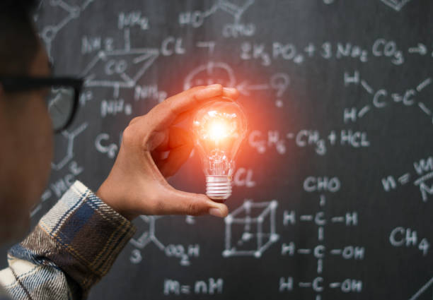 istock Young businessman with light bulb in idea concept 1006854016