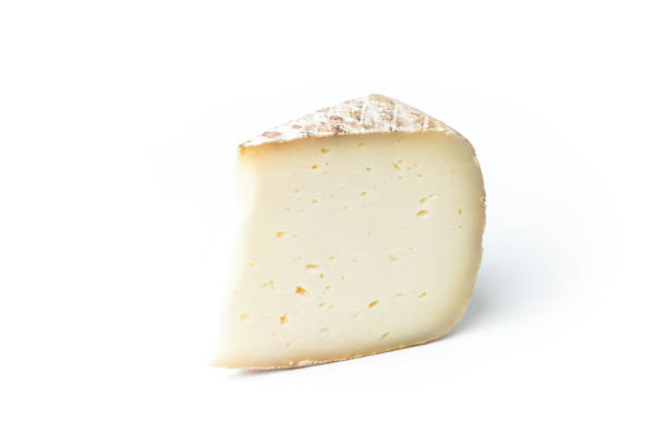 istock Close-Up Of Cheese Slice Against White Background 1006858878