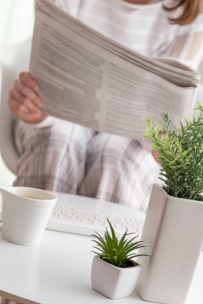 istock Woman reading newspapers 1006861772
