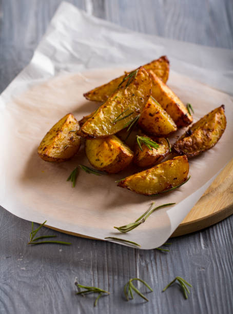 istock grilled potatoes rosemary wooden background 1006867838