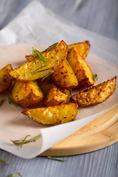 istock grilled potatoes rosemary wooden background 1006868974