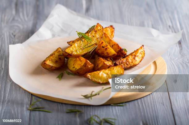 Grilled Potatoes Rosemary Wooden Background Stock Photo - Download Image Now - Prepared Potato, Raw Potato, Rosemary