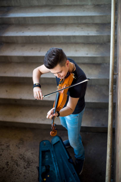 istock Street musician playing violin 1006869556
