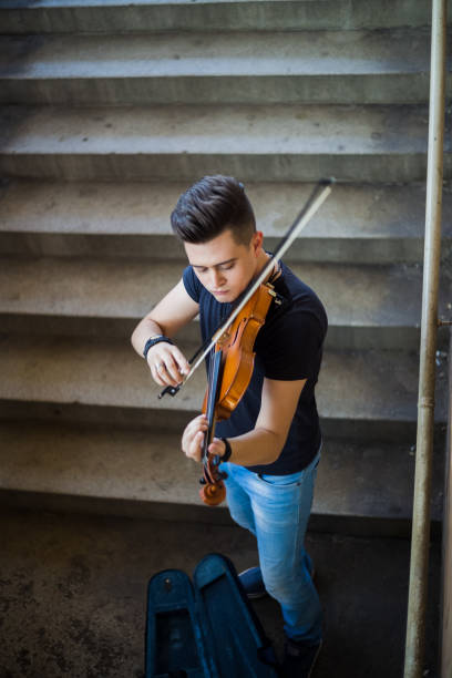 istock Street musician playing violin 1006869674