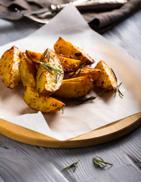 istock grilled potatoes rosemary wooden background 1006869962