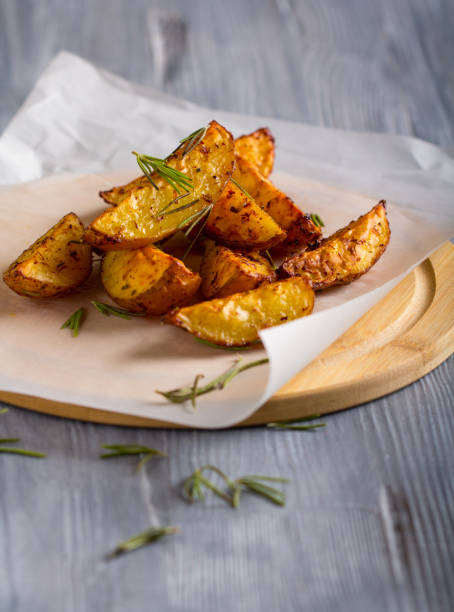 istock grilled potatoes rosemary wooden background 1006870322