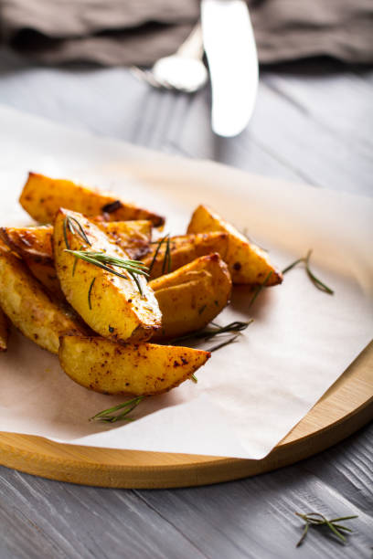 istock grilled potatoes rosemary wooden background 1006875190