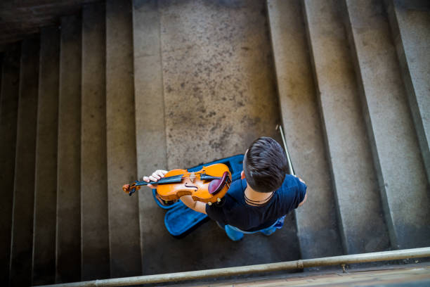 istock Street musician playing violin 1006875268