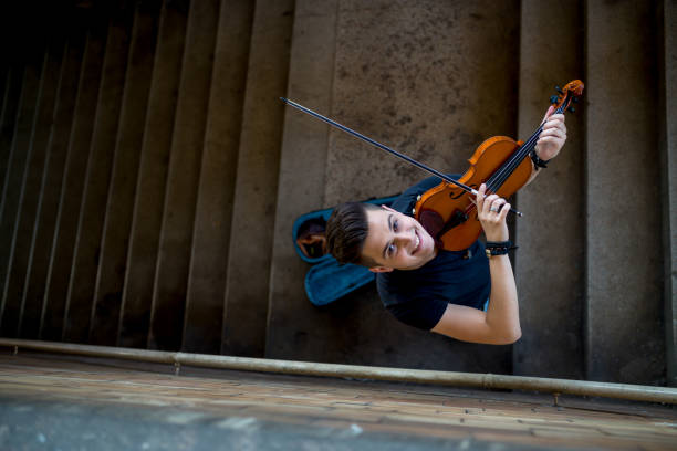 istock Street musician playing violin 1006875358