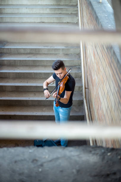 istock Street musician playing violin 1006875466