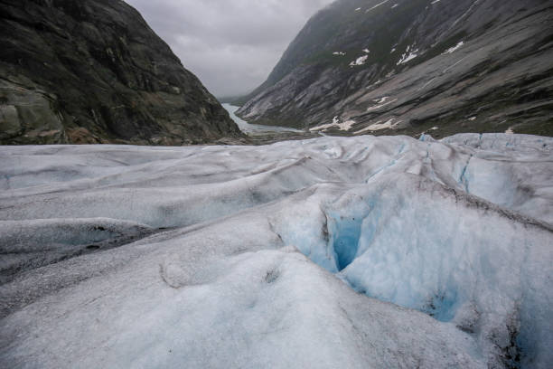 istock Blue ice of Nigardsbreen glacier 1006895624