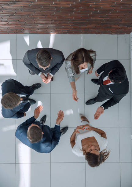istock top view. the business team is brainstorming 1006900738