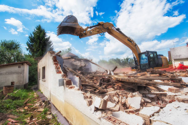 istock Tellow digger destroying a countryside house 1006917446