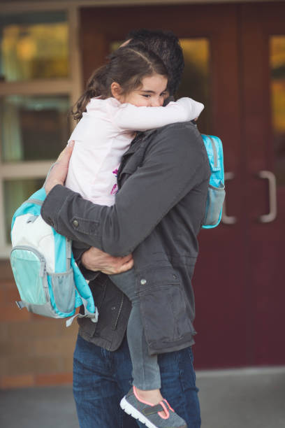 istock Dad drops little girl off at school 1006919918