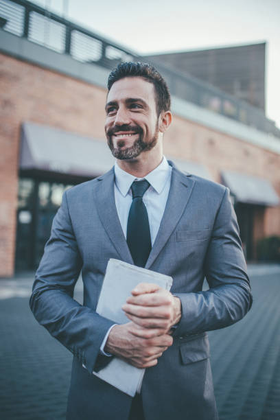 istock Handsome gentleman in gray suit 1006933194