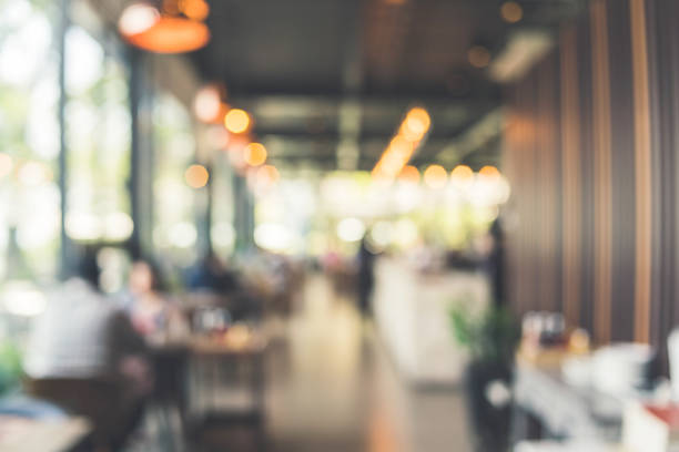 istock abstract blur image background of restaurant with people customers 1006940556