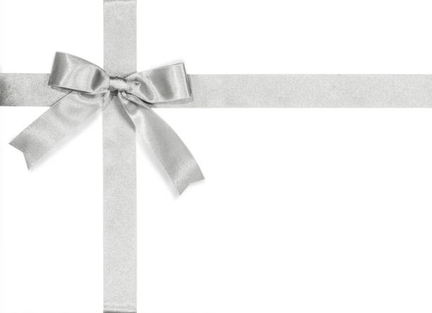 istock Silver bow satin ribbon isolated on white background with clipping path for gift box wrap and holiday card design decoration element 1006940604
