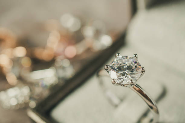 istock luxury engagement Diamond ring in jewelry gift box 1006940666