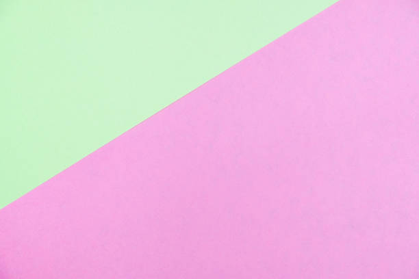 istock Pastel colored paper flat lay top view, background texture, green and pink 1006940748