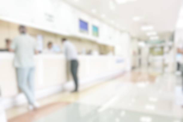 istock Medical blur background customer reception or patient service counter, office lobby in hospital clinic, or bank business building blurry interior inside waiting hall area 1006940992