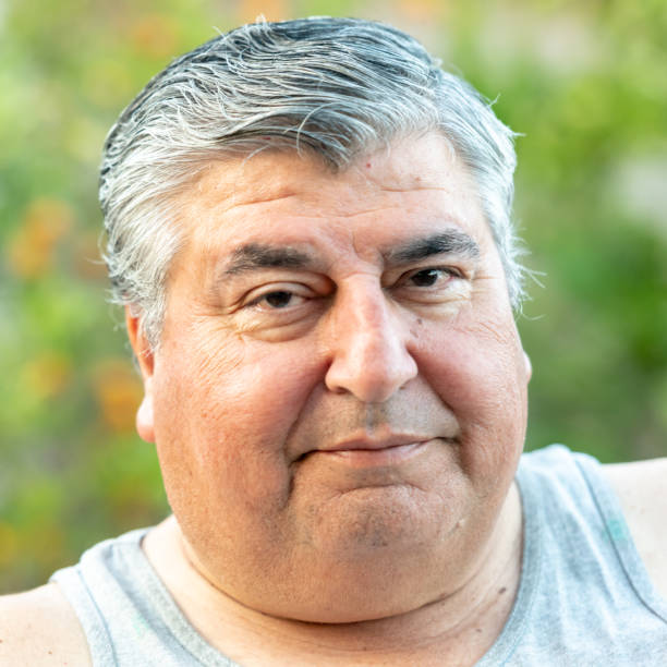 istock Smiling overweight senior/mature man 1006948130