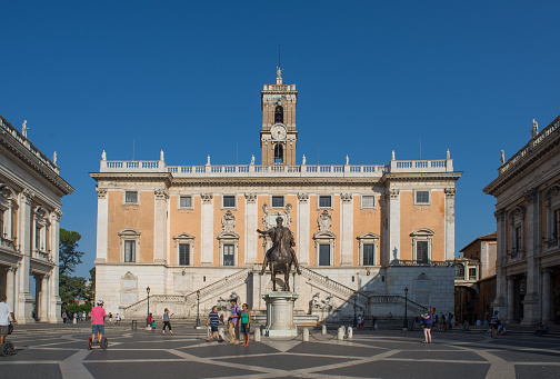 Rome, Italy - July 12, 2015: Tourists and Roman citizens on the Capitoline Hill, in Piazza del Campidoglio in the center of Rome, Italy
