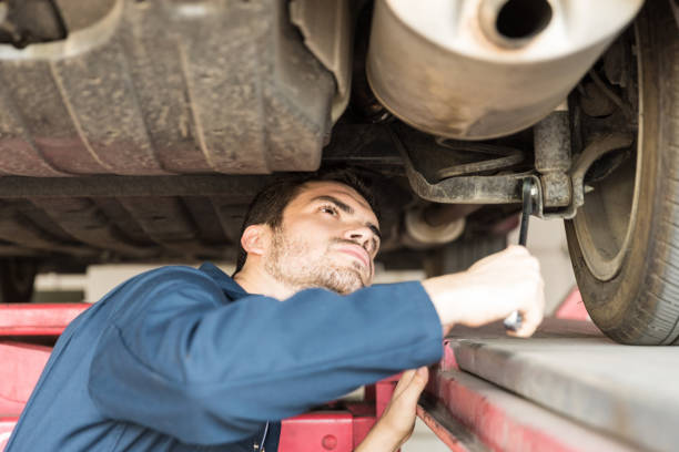 istock Automotive Expert Examining Car In Auto Shop 1006968672