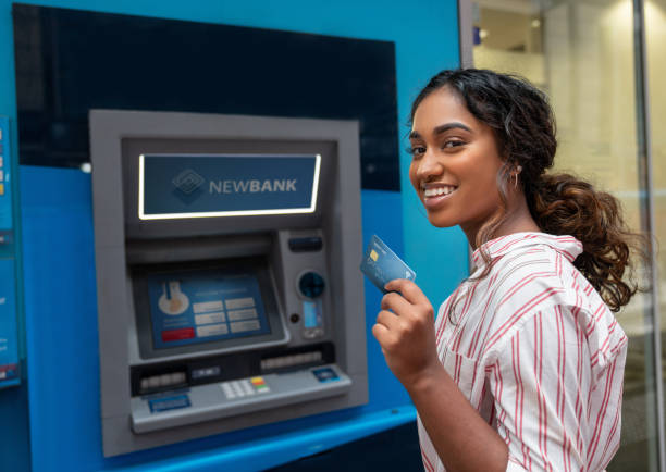 istock Woman making a cash withdrawal on an ATM 1006969038
