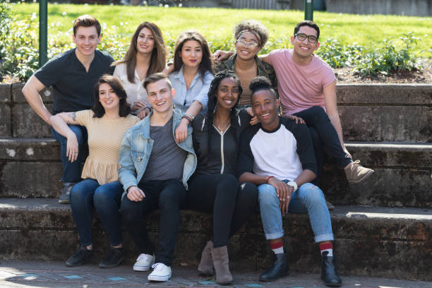 istock College students in a group photo outside 1006971100