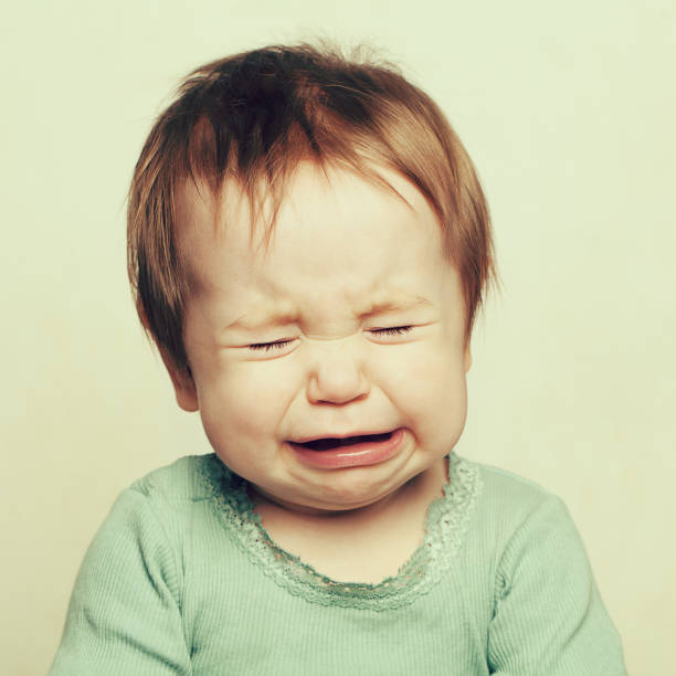 istock Crying little baby, 6 months old 1006981616