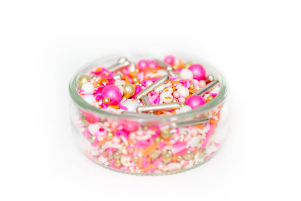 istock Colorful pink sprinkle blend on a white background. 1007004280