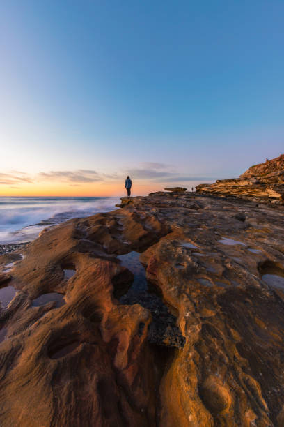istock One person at the rock cliff 1007009248