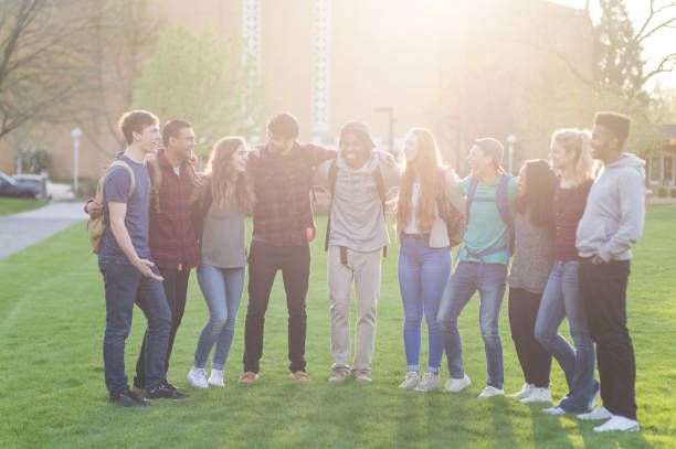 istock College students stand with their arms around one another on campus 1007011582