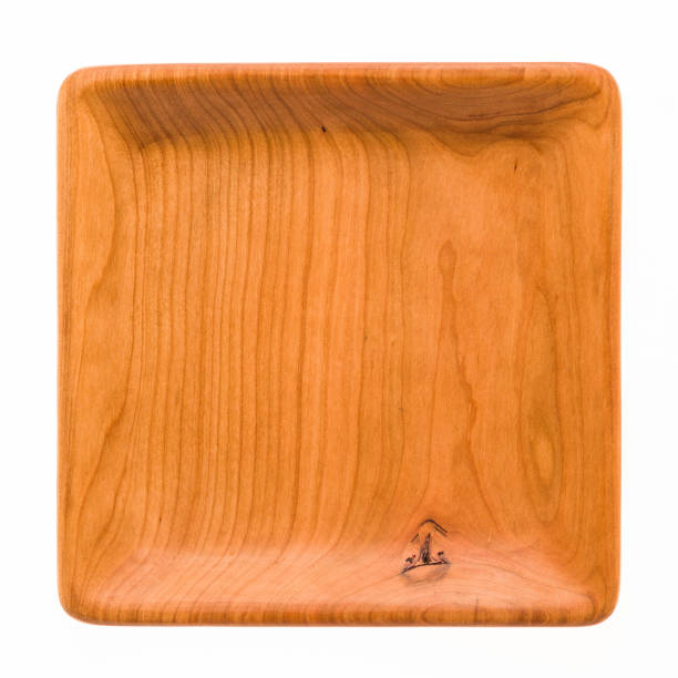 istock Square handmade cherry wood wooden plate, cherry wood texture background 1007014082