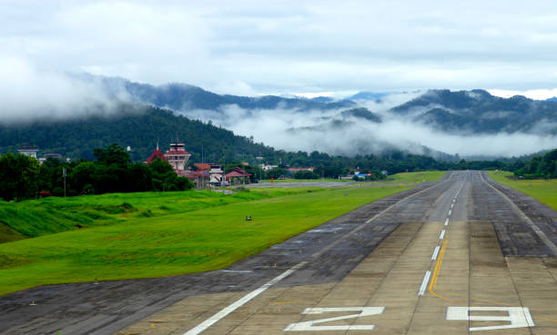 istock Airport runway with mountain in countryside 1007016916