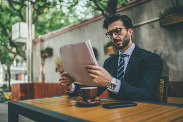 istock Businessman reading newspaper 1007024670