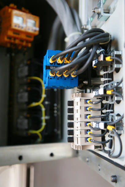 istock Electrical terminal in junction box and service by technician. Electrical device install in control panel for support program and control function by PLC. routine visit check equipment by technician. 1007043998