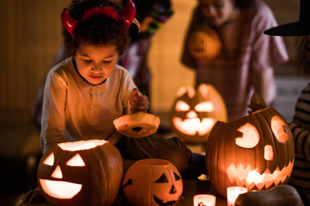 istock Small African American boy on Halloween at home. 1007049534