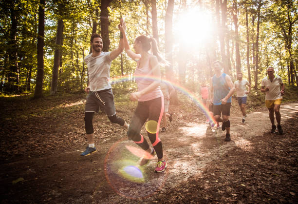 istock Happy couple giving each other high-five while running marathon race in nature. 1007049726