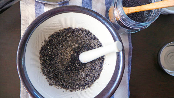 istock Black Sesame Grinding in grinder bowl 1007056748